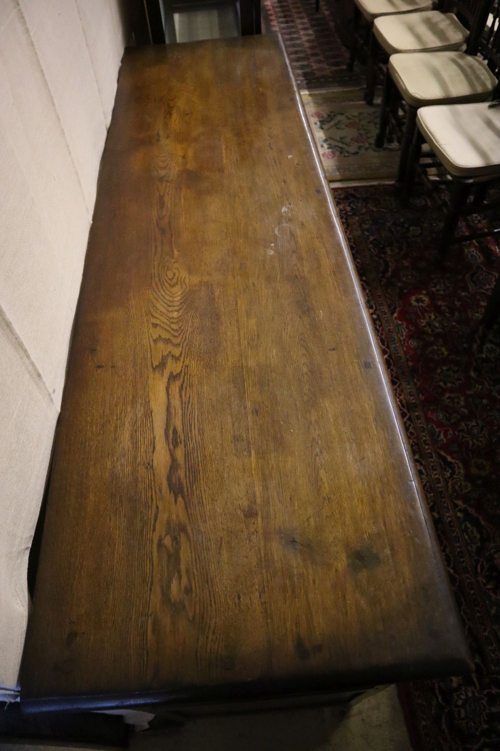 An 18th century-style oak refectory dining table, sideboard and four chairs, table 182 x 79cm height 76cm